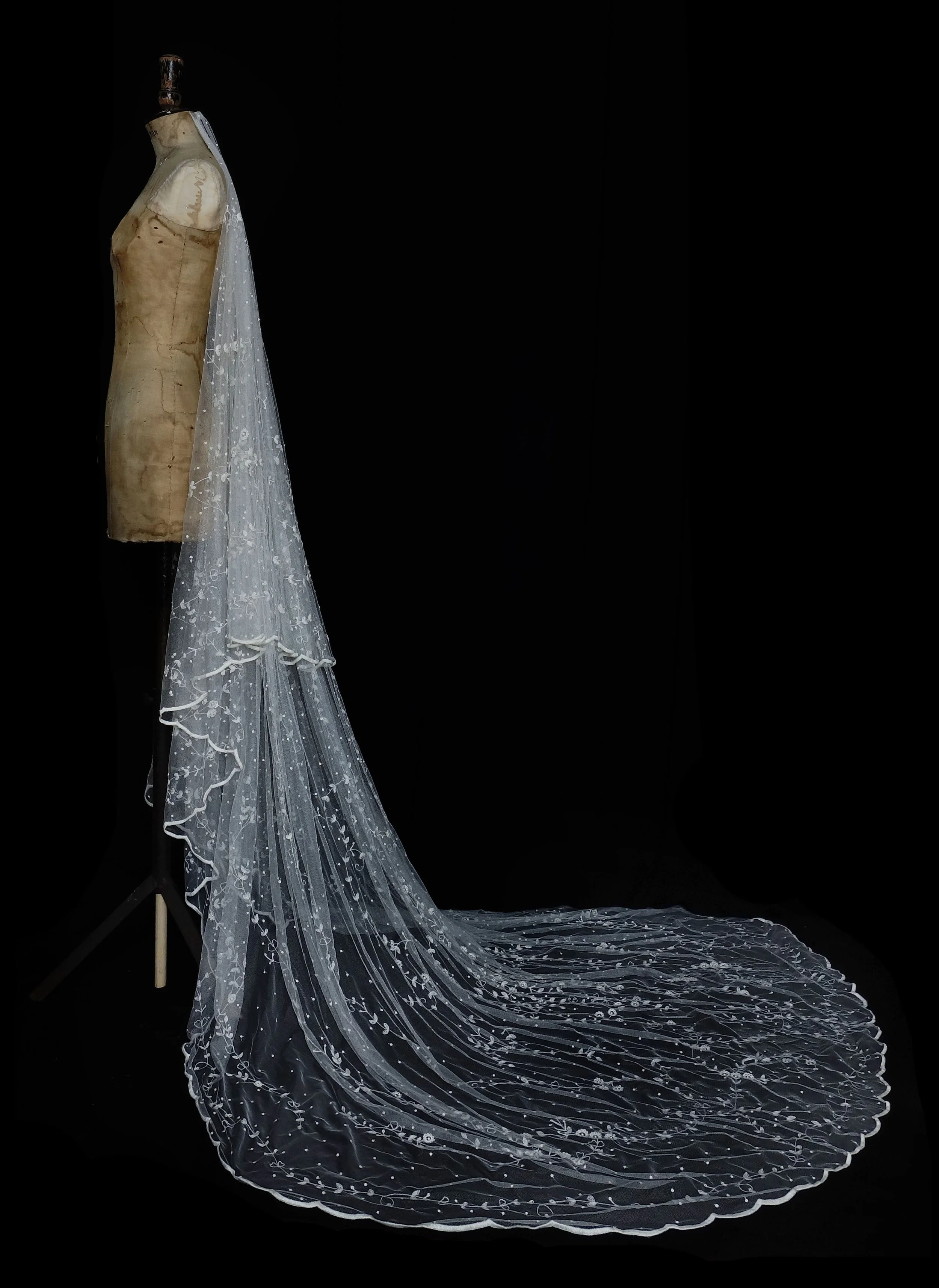 Delicately hand embroidered wedding veil with floral detail and